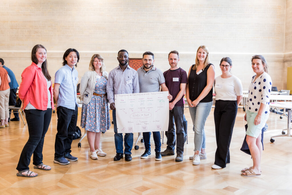 Nine people from the regenerative agriculture project team pictured at the 2023 Crucible event.