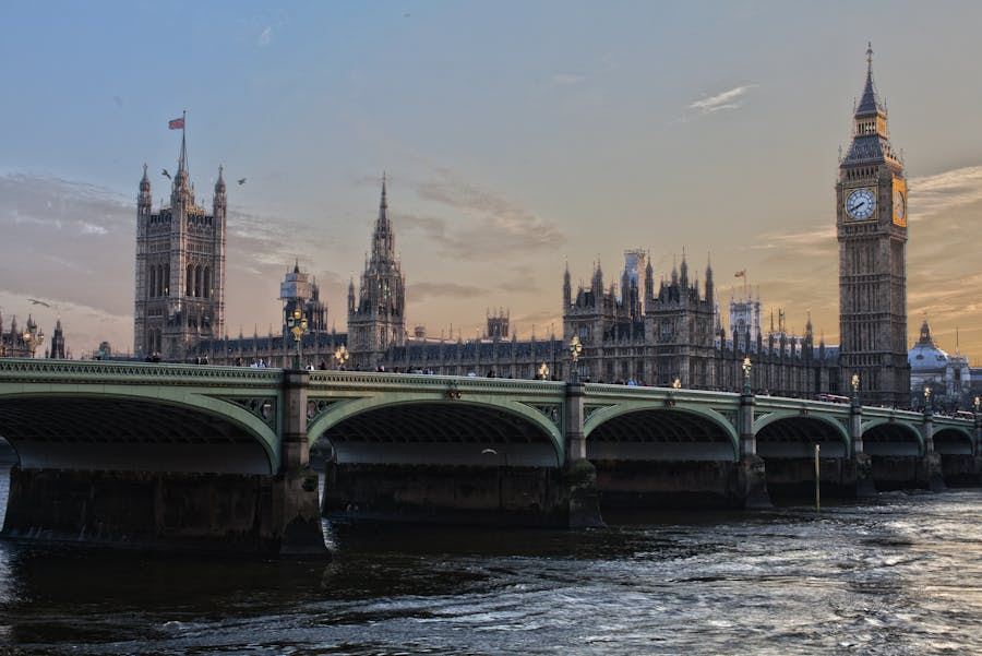 Westminster Bridge, with the Palace of Westminster beyond, at sunset.